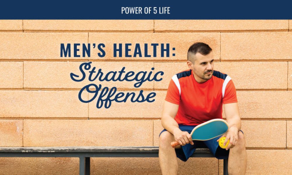 man on a bench holding a pickle ball paddle for a blog post about men's health for men's health month and the strategic offense needed