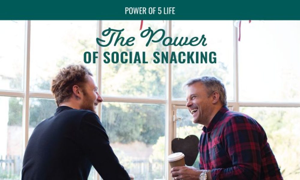 two men catching up at a coffee shop in a blog post about "social snacking"