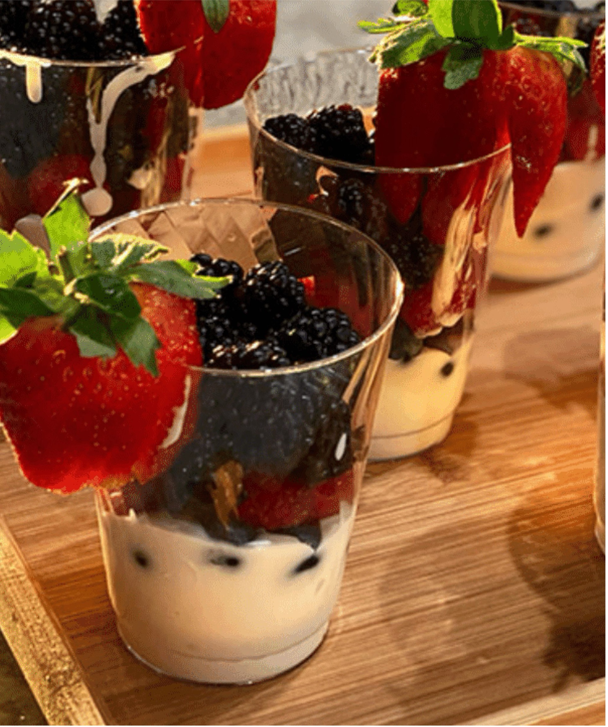 yogurt parfait with berries and dark chocolate drizzle