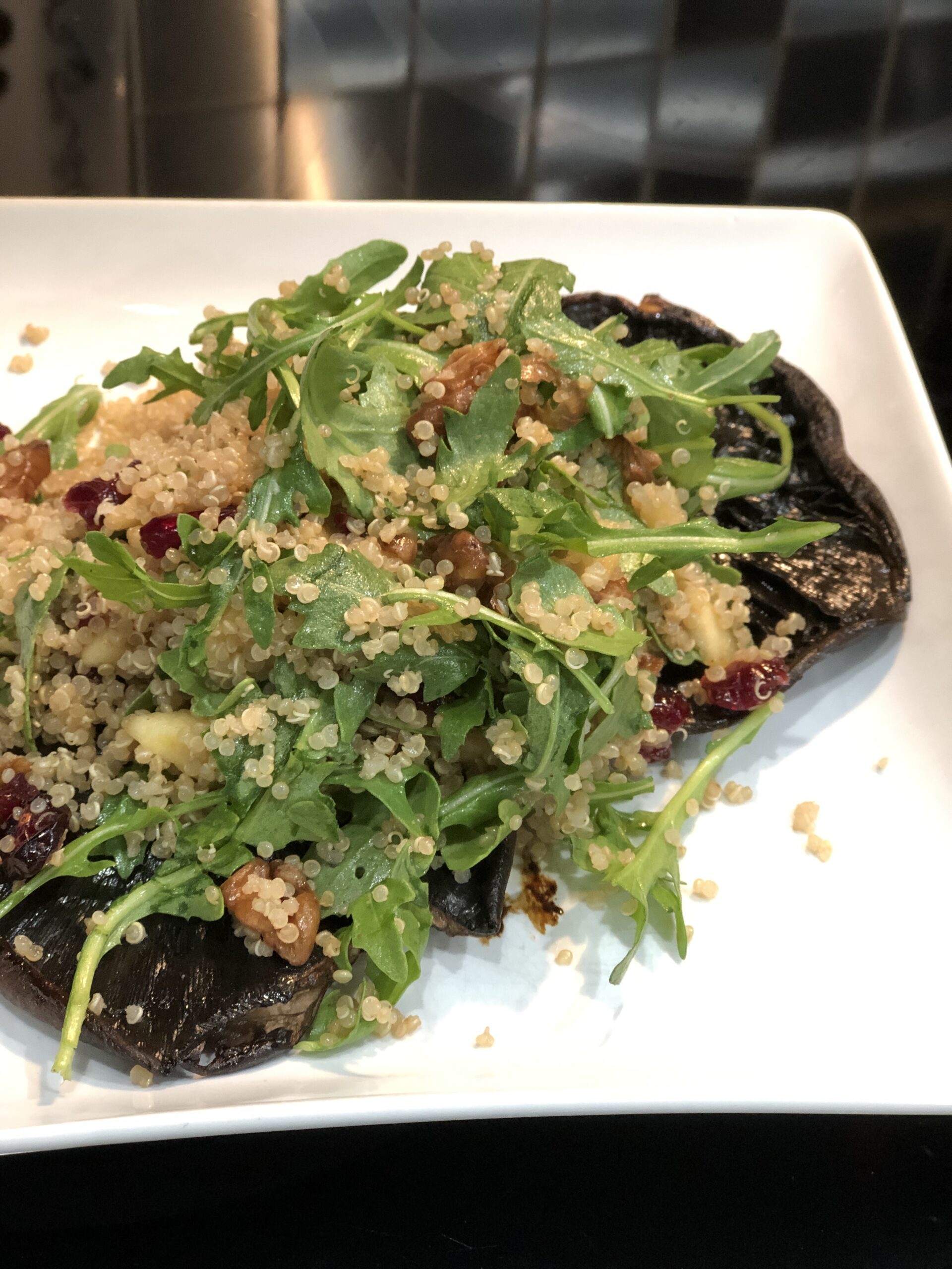 quinoa harvest salad in a portobella mushroom