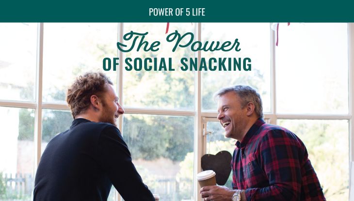 two men catching up at a coffee shop in a blog post about "social snacking"