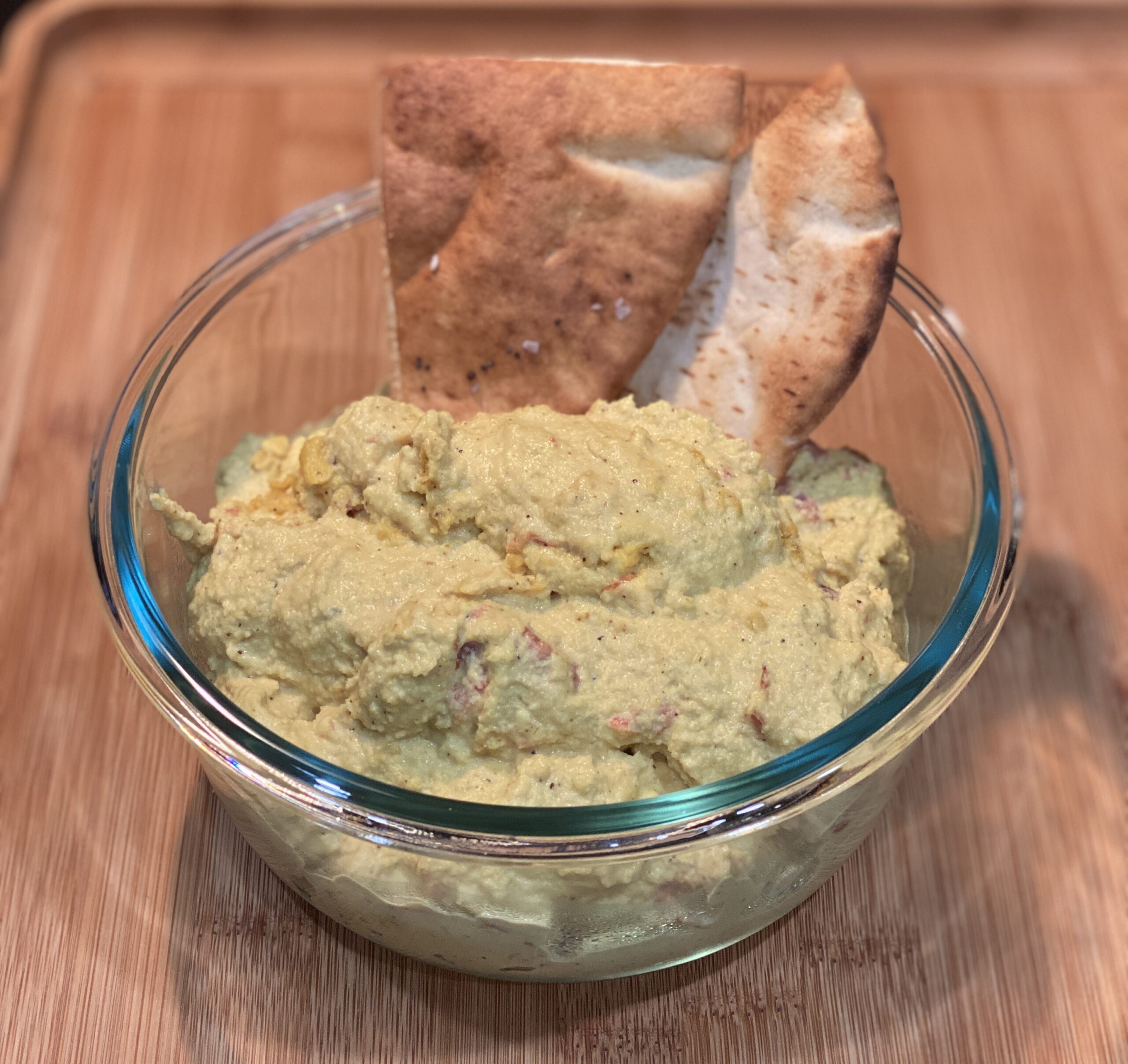 warm cashew queso with baked pita chips